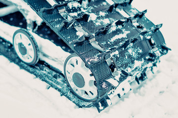 Caterpillar of snowmobile at winter Finland