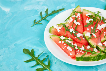 Fresh summer watermelon salad with feta cheese and arugula