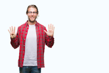 Young handsome man with long hair wearing glasses over isolated background showing and pointing up with fingers number nine while smiling confident and happy.