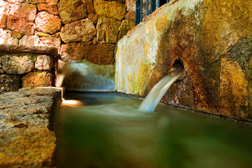 Fountain spring with rocks in the mountain