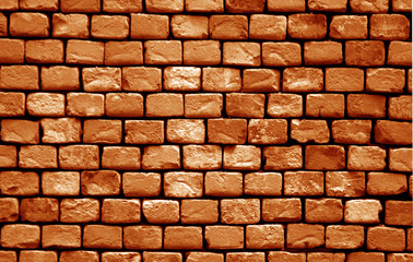 Naklejka premium Old grungy brick wall surface in orange tone.