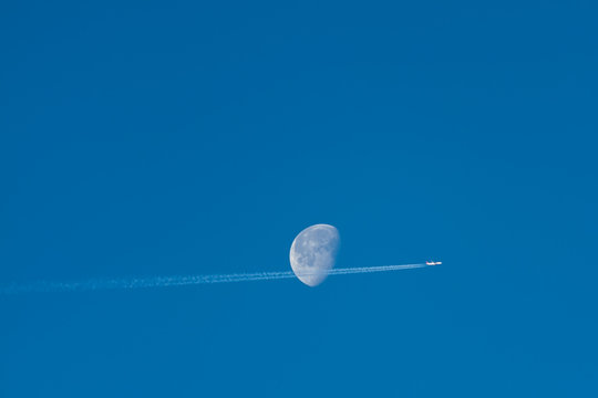The airplane with the moon on a blue background.