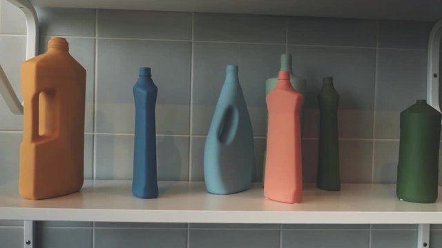 Detergent Bottles on Metal Shelf