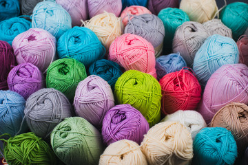 Colorful skeins of yarn on a gray-blue background. Studio shooting