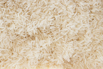 Rice, white grains. Basmati. Unpolished, uncooked, natural, diet, raw asian cuisine, dish. Texture pattern background, copy space.