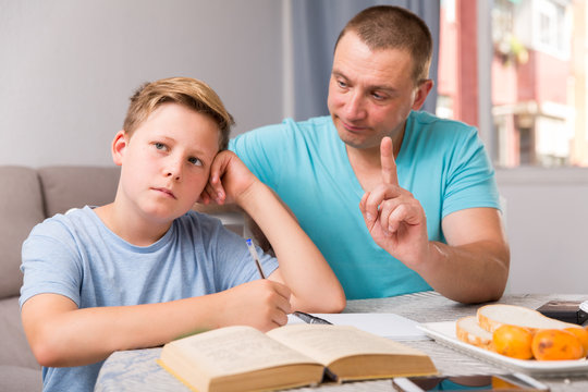 Guy and his father are conflicting in time doing homework