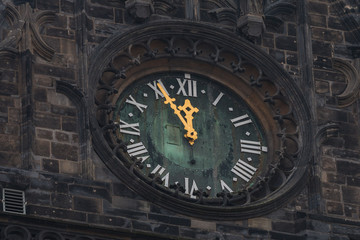 Tower clock five minutes to twelve