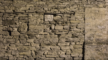 Desaturated vintage rock stone wall