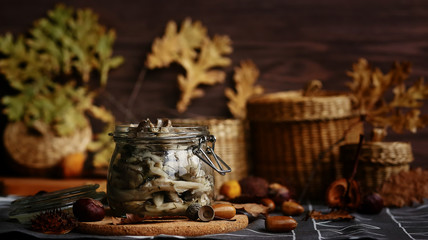 Marinated mushrooms with butter in a glass jar. Harvesting products for the winter.