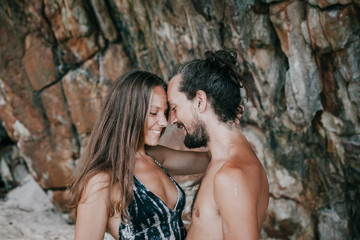 Beautiful couple hugging at the beach