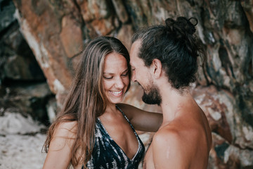 Beautiful couple hugging at the beach