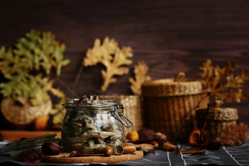 Marinated mushrooms with butter in a glass jar. Harvesting products for the winter.