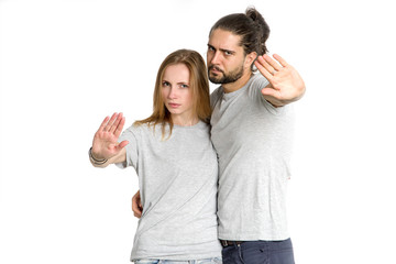 Fototapeta premium It is no. Two young people gesturing rejection. Couple man and woman not disagree, they put a symbol of denial in their hands.