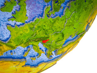 Slovenia on 3D model of Earth with water and divided countries.