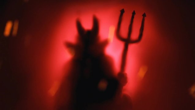 Animated Creepy Devil silhouette from hell in the mist with backlit.