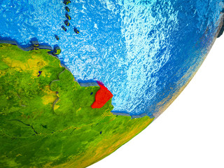 French Guiana on 3D model of Earth with water and divided countries.