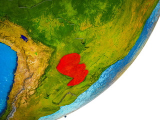 Paraguay on 3D model of Earth with water and divided countries.