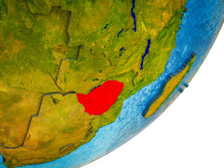 Zimbabwe on 3D model of Earth with water and divided countries.