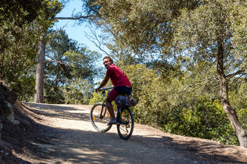 Fototapeta na wymiar Bicycle trip in a wood on the island of Porquerolles