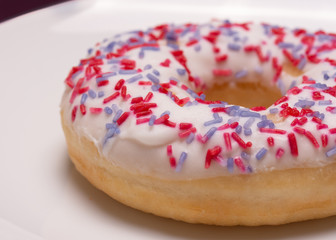 Closeup of a donut on a white plate
