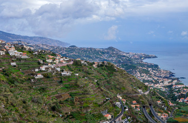 Fototapeta na wymiar City on the hilly coast of Madeira Island, Portugal.
