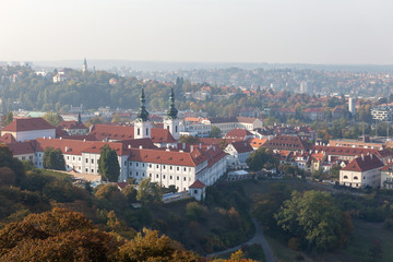 Fototapeta na wymiar PRAGUE, CZECH REPUBLIC - OCTOBER 09, 2018: View of the Strahov Monastery and Prague Castle from the Petrin Tower.