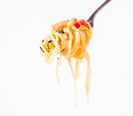 Spaghetti Carbonara with some parsley on a fork on a white background