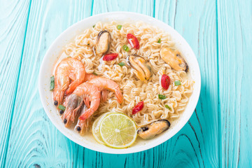Instant noodles soup with shrimps and mssels . Asian food