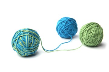 Colorful cotton thread ball from two color green and blue thread isolated on white background....