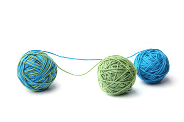 Colorful cotton thread ball from two color green and blue thread isolated on white background....