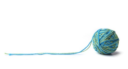Colorful cotton thread ball from two color green and blue thread  isolated on white background.  Different color green and blue thread mix. 