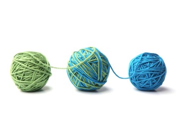 Colorful cotton thread ball from two color green and blue thread isolated on white background....