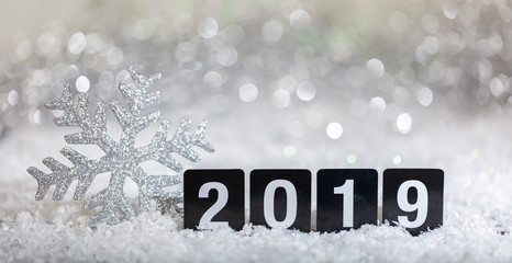 New year 2019 on snow, abstract bokeh lights background
