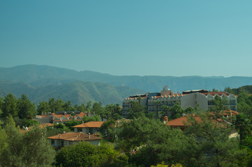 Mountain town panoramic view. city between the hills