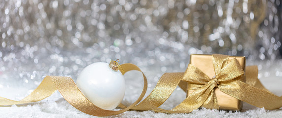 Christmas balls and gift, abstract bokeh lights background