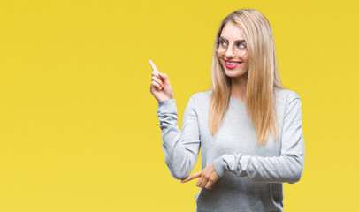 Young beautiful blonde woman wearing glasses over isolated background with a big smile on face,...