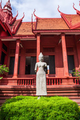 Ancient statue of Apsara in front of the National Museum of Cambodia.
