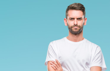 Young handsome man over isolated background skeptic and nervous, disapproving expression on face...