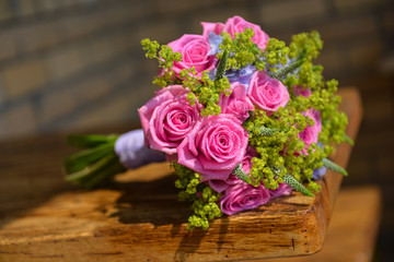 bridal bouquet of fresh roses on the table. wedding floristry, floristic decorative statement