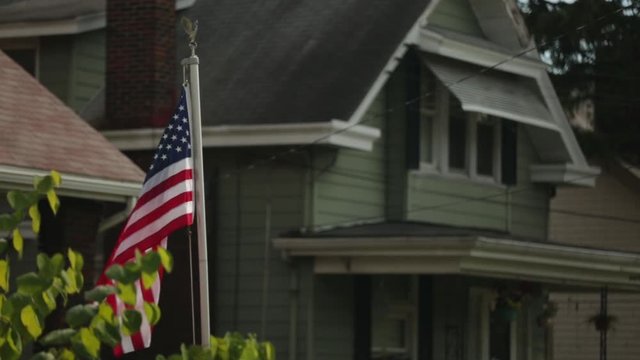 American flag flying in old neighborhood
