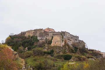 Fototapeta na wymiar Small village perched on top of hill, Barrea, Abruzzo, Italy. October 13, 2017