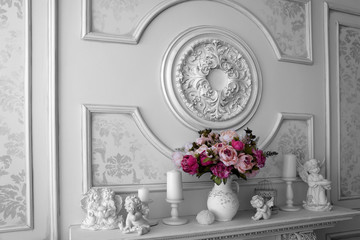 Shabby chic interior decor for farmhouse. Lavender in pitcher, lantern and wooden letters on a vintage shelf over pastel wall. Provence home decoration.