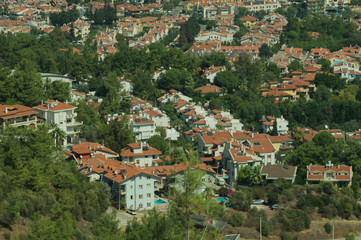 Fototapeta premium Mountain town panoramic view. city between the hills
