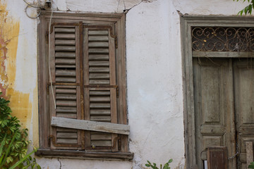 Fototapeta na wymiar slum city district poor wooden back yard closed window frame and door background 