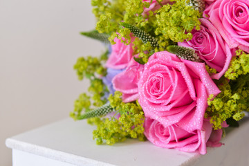 bridal bouquet of fresh roses on the table. wedding floristry, floristic decorative statement