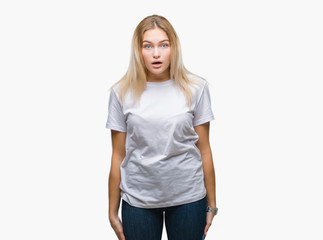 Fototapeta premium Young caucasian woman over isolated background afraid and shocked with surprise expression, fear and excited face.