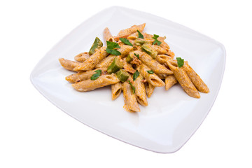 Pasta with asparagus and cream on a white background