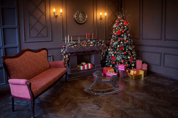 New Year's interior with a fireplace and a Christmas tree