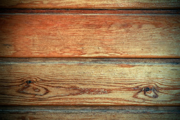 Vignetted brown and yellow wooden background