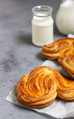 Yeast sweet buns with sugar in the shape of a heart. Traditional russian sweet buns.